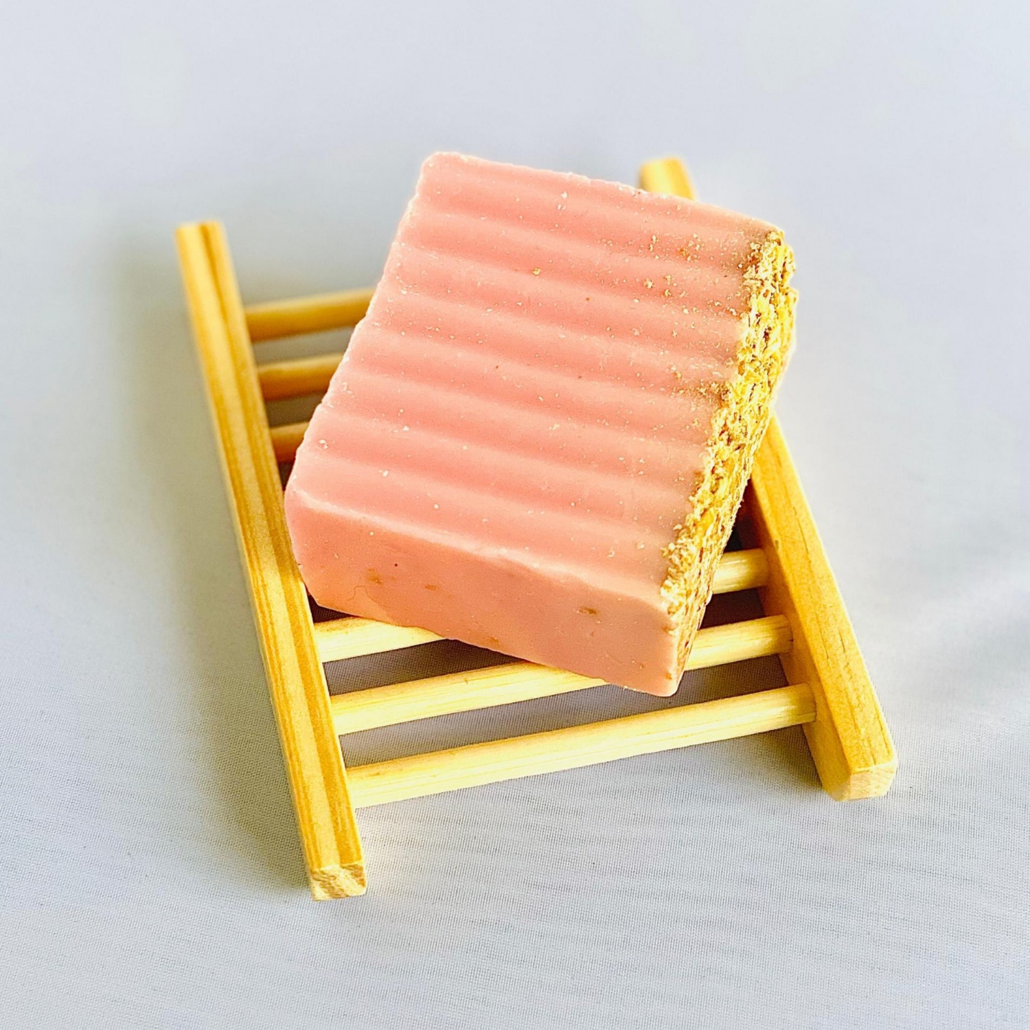 Pure Skin Soap Collection- A bar of Pure Skin's Love Potion Soap Bar on Pure Skin's Bamboo Soap Saver
